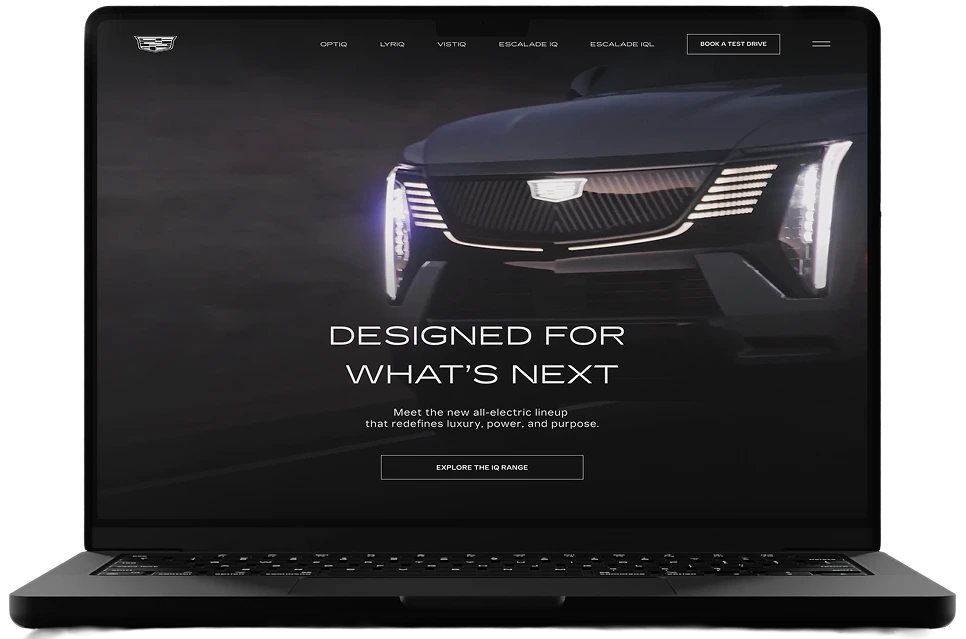 Cadillac IQ website on laptop
